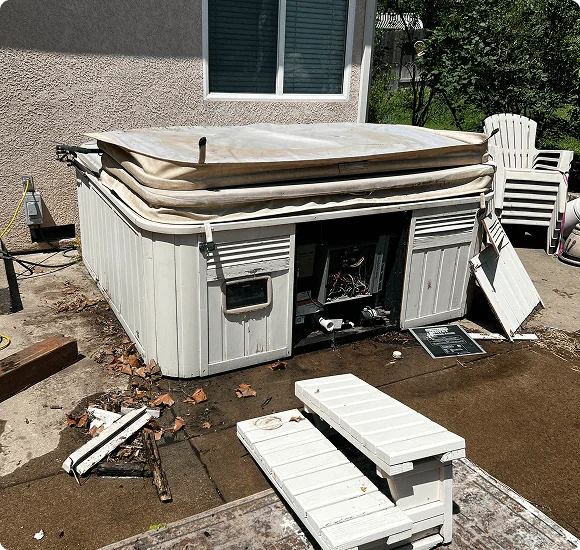 Hot tub removed from a deck in a Sacramento backyard