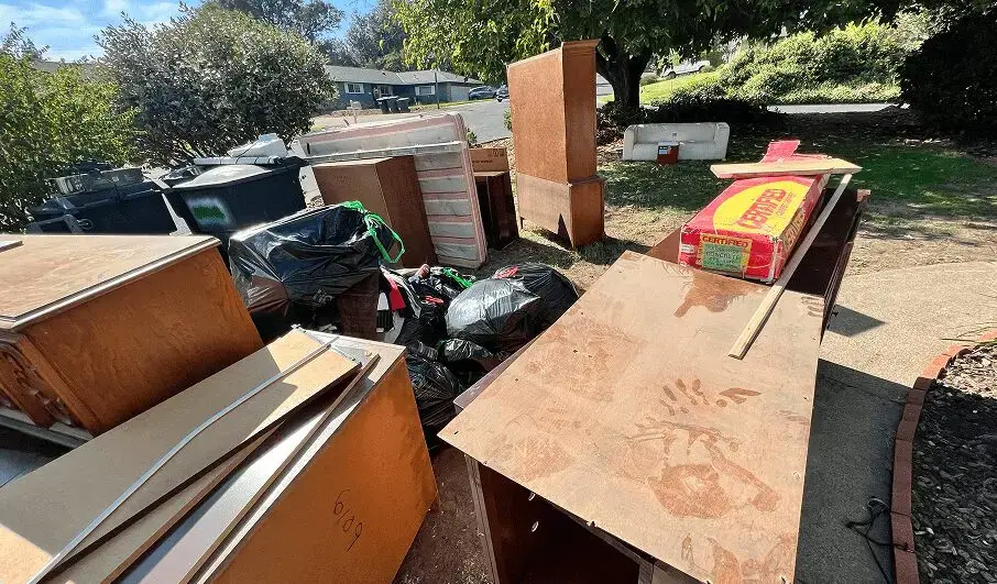 Furniture and cabinets staged for a full house cleanout